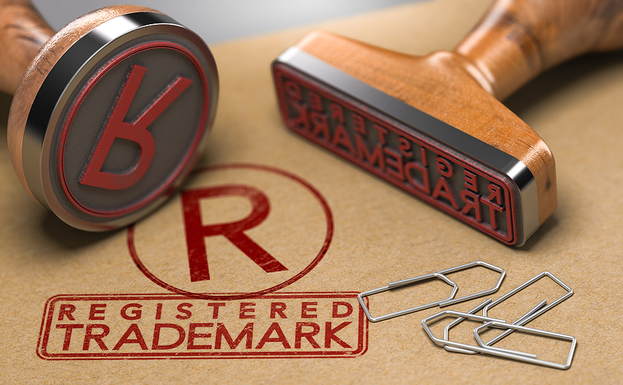 illustration of two rubber stamps with the text registered trademark